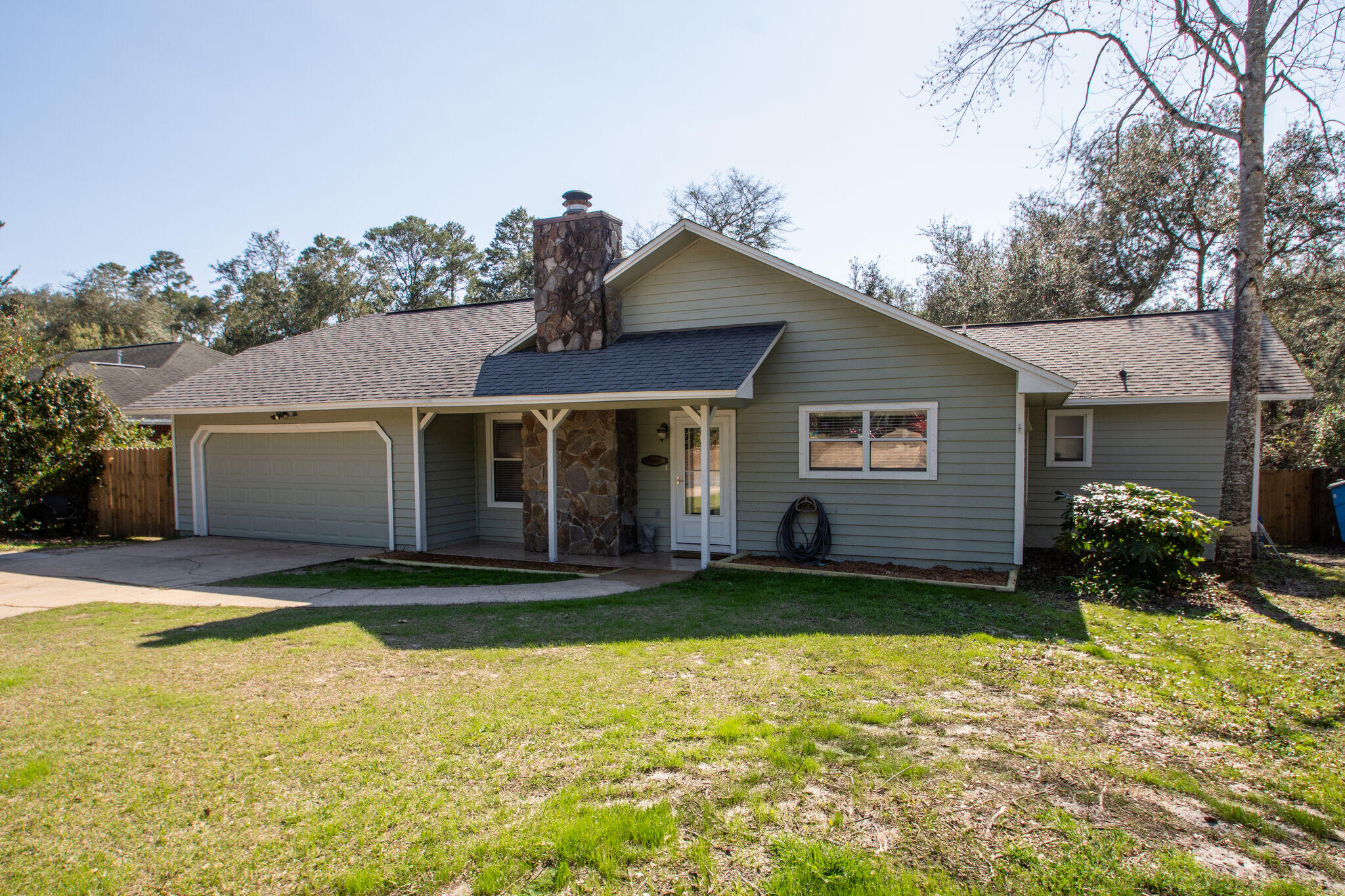 Welcome to Bluewater! This affordable home offers a large living area with fireplace and cathedral ceilings. Open floorpan lives larger than its sq footage. Updated kitchen with newer stainless steel appliances and an island. Bedrooms overlook a spacious back yard with 2 large decks. The home is equipped with a ring security system, the exterior was painted in 2019, HVAC replaced 2013, fence and water heater in 2020. No HOA so you can park your boat and there is 50amp service is avail for your RV. Enjoy the neighborhood bike trails, pool membership, tennis courts and golf courses. You can jet about to the local restaurants on your golf cart. Located about 20 mins to Eglin AFB, Destin beaches, or Destin Commons. Lawn pump/sprinkler system convey as is. Buyer to verify all measurements