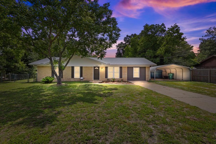 Welcome to 306 Forrest Parkway! This beautifully refreshed brick home offers a blend of classic charm and modern comfort on a generous .46-acre fully fenced lot in a peaceful Crestview setting.Step inside to a bright and open layout featuring luxury vinyl plank flooring throughout, fresh interior paint, recessed lighting, and updated fixtures that give the home a clean, modern aesthetic. The spacious living and dining areas flow into a light-filled kitchen with new countertops, sink, and faucet, offering a welcoming space to gather and entertain.This home includes 3 comfortable bedrooms, 1.5 stylishly updated baths, and a flexible office or bonus room, perfect for remote work, hobbies, or extra storage. The large laundry area adds function to form, with space to keep life organized.

Outside, you'll find a metal roof (2015), updated windows (2021), HVAC system (2017), and water heater (2021)giving you peace of mind for the years ahead. A detached metal carport and a backyard storage shed (conveys as-is) add convenience, while a portable generator also conveys as-is for added security.

With a spacious lawn shaded by mature trees and room to roam or garden, this property offers both style and substance. Schedule your showing today and explore the possibilities!