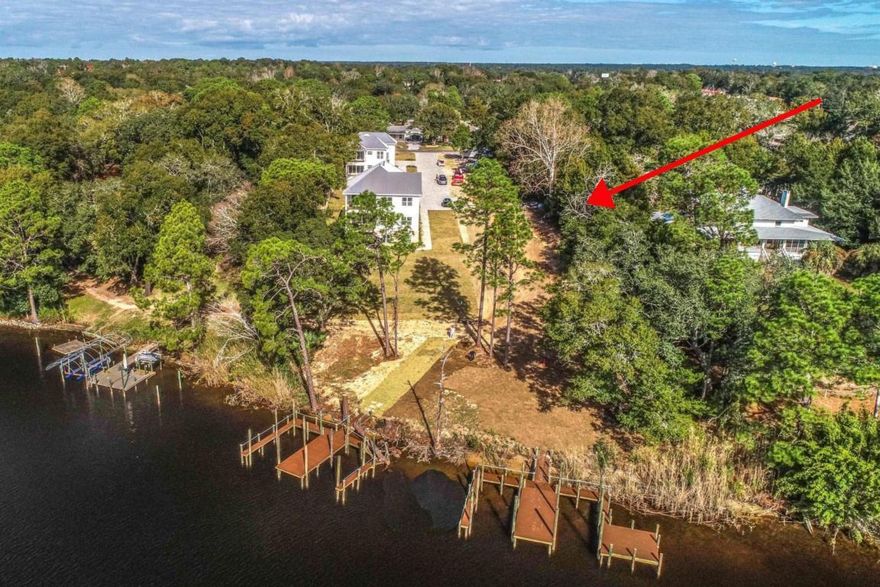 Tom's Bayou Waterfront Lot available & read to be built. Parade of Homes Winner offering to build your dream home similar to its neighboring stunning new constrcutions. You may use what the builder has or make adjustments. Fish off your dock, hop in the boat and hit the water for an afternoon of sun or take off for a romantic evening of waterfront dining. Bayou Place offers 4 BRAND NEW Homes, 2 water front with docks and 2 just off the water with their own dock and water access. Pictures Include information on the homes the builder has built in the community. Lot has sewer taps, water taps, has been cleared & drain lines installed.