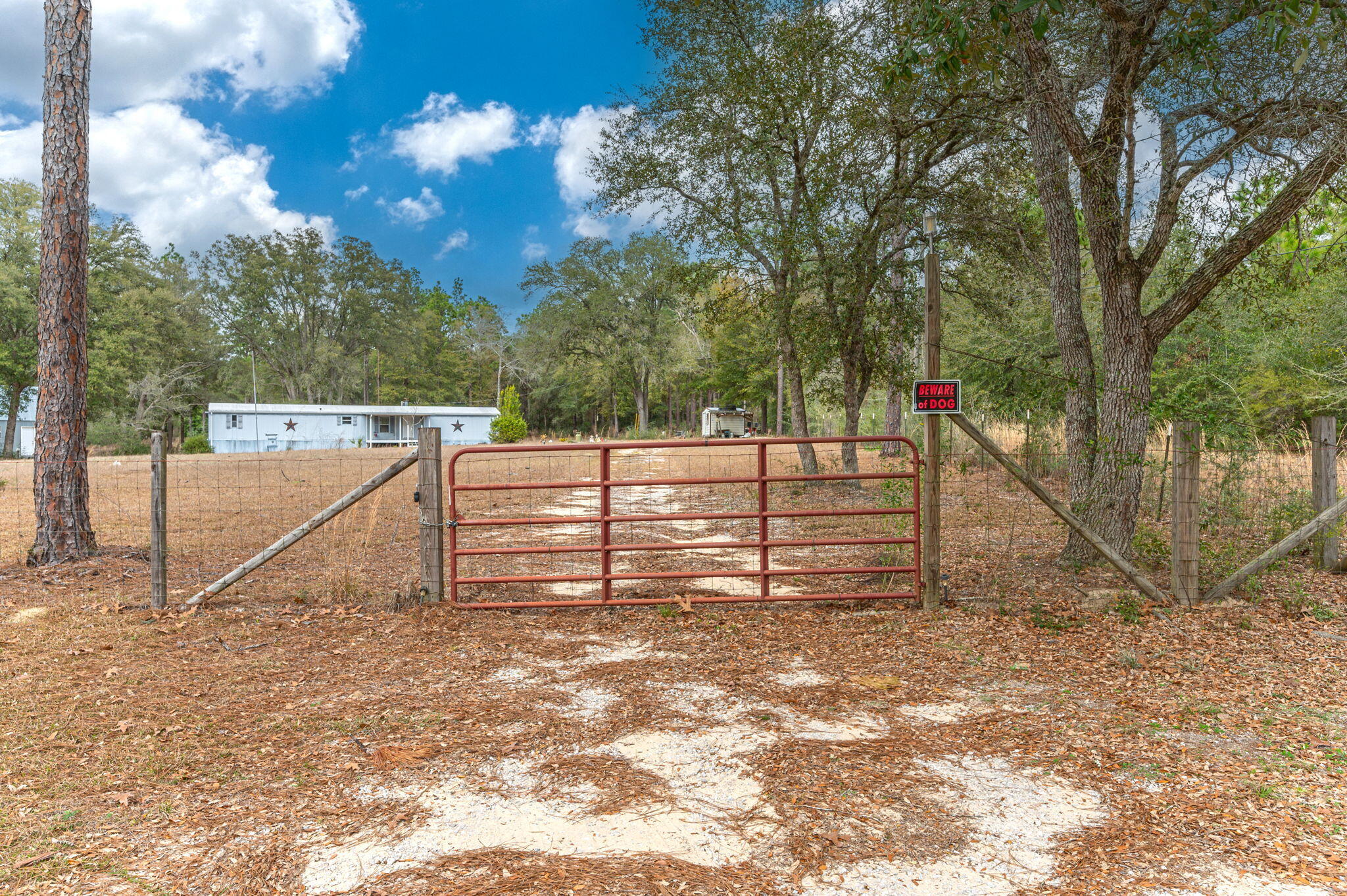 Welcome to 4507 Rainbird Rise Road, a charming rural retreat in Crestview, FL 32539. Set on a generous 4.66-acre lot, this property features a comfortable manufactured home that embodies the simplicity and tranquility of rural living. Adding to its appeal, there is also a workshop on the premises.Surrounded by open landscapes, the home offers a serene setting that captures the essence of country living. Step inside to discover a practical and well-designed floor plan. With two bedrooms and two bathrooms, the home provides a welcoming and functional environment for family members or guests.The property's expansive 4.66 acres provide ample outdoor space, including a generous backyard and a peaceful patio area. Whether you're enjoying the quietude of the countryside or hosting