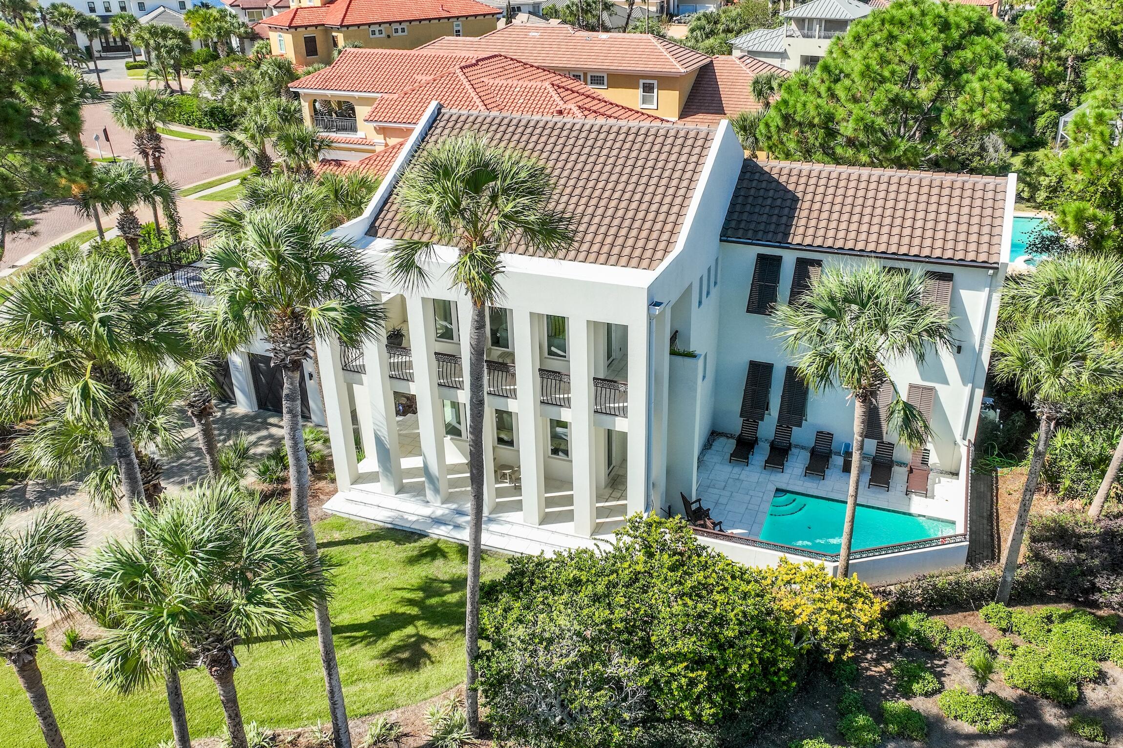 Beautifully renovated house near the beach in Destiny East. No details were spared in the construction of the house, it features concrete walls, steel rafters, steel floor and ceiling joists. That makes it resistant to storms, fire and termites and therefore it carries a lower insurance rate. The home comes fully furnished and rental ready. This home features elegant but casual living with an emphasis on entertainment areas such as a 24 x 24 separate balcony deck, a heated pool, two separate living areas, a wet bar and much more. The neighborhood association has a fitness facility, two tennis courts, two swimming pools, a media room and a meeting area. This gorgeous house has also become a popular rental because of the decor, the amenities it offers and the proximity to the beach. The house is known on the rental market as Ocean Effect and has a 4.95 rental rating. This is the investment property that you have been looking for, great location (at the East entrance of the neighborhood), professionally upgraded and decorated interiors, offers lots of entertainment and has a proven rental record and high rental ratings from guests. Do not miss your chance to purchase Ocean Effect!