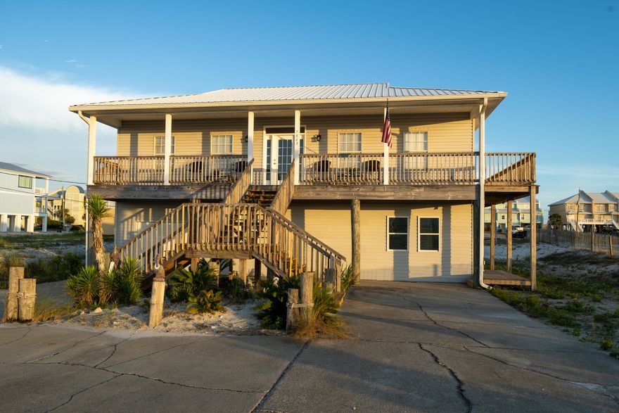 Under Contract - Accepting Back Up Offers . Welcome to The Sand Box at 7863 White Sands Boulevard.  Lovingly named, Sand Box, by the Owner as this beach and water lover's home rests on a homesite overlooking white rolling dunes and the sound with views to the Gulf of Mexico.  Miles of beautiful vistas unfold before your eyes and from the east side of the porch beyond a tall stand of pine trees you can see to the Navarre Bridge.  The evening breeze and sunsets are reminiscent of time gone by on this quiet street on Navarre Beach.  The American flag gently waves as the sun sets on another perfect day living the good laid back beach life. You will live just a short walk to the beach as this home is ideally located for water lovers. Live and entertain in casual Florida style! A southern facing, large terrace is ideal for sunning and captures views of the gulf.  Each bedroom south facing and the master bedroom and one guest bedroom let on to the oversized wrap around balcony.  The balcony is also accessible from the living room and is an outdoor living space.  Its gracious size lends itself to plenty of seating for the whole family and guests for outdoor living. The open floor plan marries the kitchen and eat in niche to the living room. A laundry room conveniently adjoins the kitchen. Make an appointment today to see 7863 White Sands Blvd and plug in and start playing at the beach!  