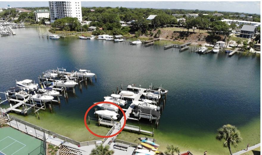 Welcome All Destin Boaters!  This Dolphin Point unit has been COMPLETELY and professionally renovated with so many details that really set it apart from the rest...AND it comes with a really offered BOAT SLIP!  (B21).  You'll notice many of the differences immediately as you walk through the solid-wood front door into the renovated kitchen with new cabinets, all new stainless appliances, hands-free no-touch faucet, even an Air Fryer stove with all quartz countertops.  Main living areas have durable new wood-looking tile and the bedrooms have new carpet.  Both bathrooms have also been completely redone with all new tile showers, counters and Toto toilets with one having a bidet feature.  Other appliances include new stackable washer & dryer in unit, new water heater, new