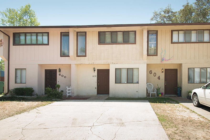 Great investment property and great mid-town location! Close to everything!2 good sized bedroom with a full bath in between them upstairs and a 1/2 bathroom downstairs. Laminate flooring everywhere except bedrooms/stairs which are carpeted. Full laundry room off kitchen. Small fenced back yard. Roof replaced in 2015. Unit in good shape but being sold As-Is.