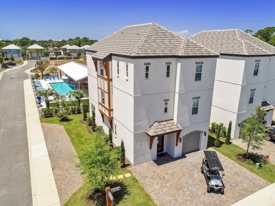 This is a brand new Beachside development in Miramar. Tons of upgrades, 66'' fridge/freezer , custom tile, hardwood floors and ceiling. Beautiful community pool and fully stocked fishing pond. This community is golf cart and rental friendly. These homes are a great investment. Have several rental projections.