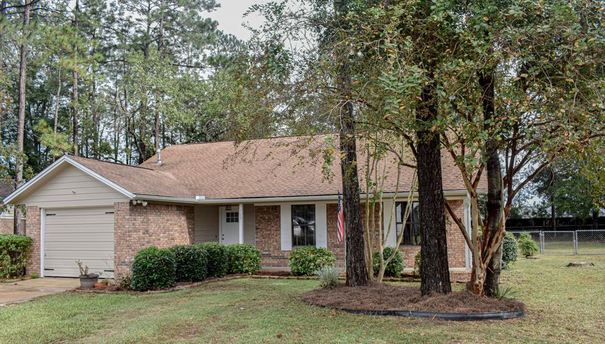 Move in ready home in South Crestview with a large FLAT lot where you can enjoy the privacy of your back yard while sitting under the pergola!  This home is ready for a new owner to move in and begin making new memories.  Beautifully updated kitchen, new carpet, Roof 2011, Septic 2018, new bathroom vanities, cathedral ceiling..it just needs you!   Convenient to shopping, beaches and military bases.  Storage sheds convey as is