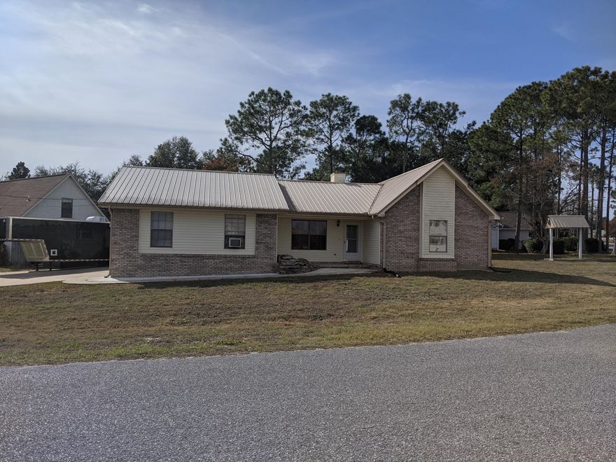Very affordable 3 bed, 2 bath home in Crestview, south of I10. This home includes a large corner lot with irrigation system and workshop. The metal roof was installed on 2005. The interior of the home features tile flooring, plantation shutters and an all brick fireplace.