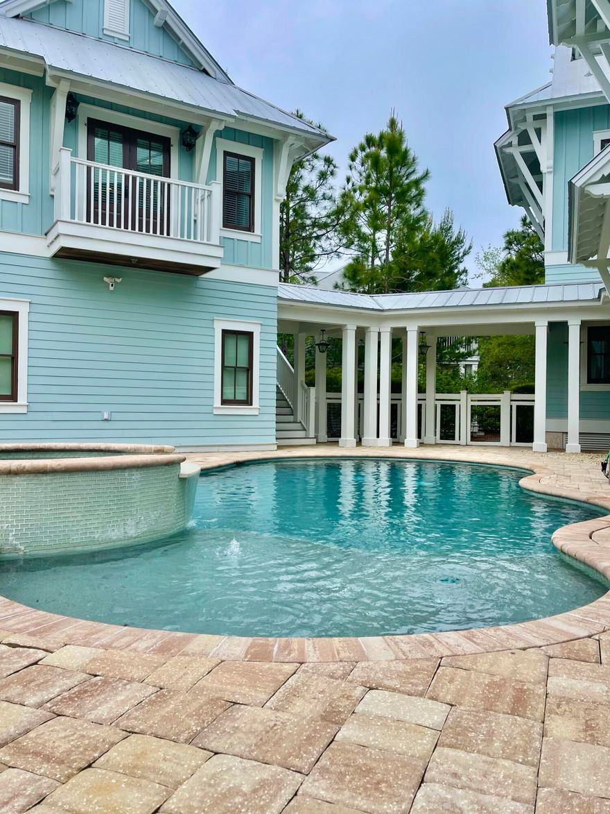 Stunning home designed by TS Adams Studio and built by Ben Giles. Pecky cypress ceilings, shiplap walls and wide plank re-finished flooring throughout. Beautiful, resort-style oasis in the back with heated pool and spa, fireplace, outdoor kitchen, audio surround system and an outdoor shower along with plenty of deck space for entertaining. This home is surrounded in the front and back by mature pines and pond views. The outdoor space separates the main home from the well appointed carriage house above the two car garage and includes a combination living room/bedroom, a bathroom, and a full kitchen.