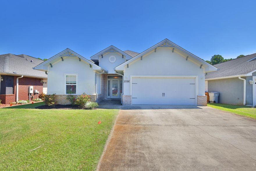 Welcome to this stunning 4-bedroom, 2-bath home with a 2-car garage, built in 2016 and located in Navarre's desirable Fountainview community. Featuring a stylish stucco and brick exterior, grand entryway, and open floor plan, it blends elegance and comfort. Inside, a bright living space flows to a chef's kitchen with granite counters, custom cabinets, stainless appliances, and an oversized island with snack bar. The master suite offers a tiled shower, soaking tub, dual vanities, and walk-in closet, while three additional bedrooms provide flexibility. Wood laminate floors, granite baths, a covered back porch, and hurricane window protection add value. Enjoy high-end finishes throughout, minutes from schools, shopping, and the beautiful Gulf Coast beaches.