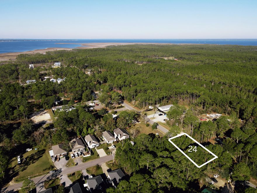Lot 24 stands out as a corner homesite, offering added flexibility for design, access, and overall layout potential. Located in North Santa Rosa Beach, where growth and demand continue to rise, this property is conveniently close to the Choctawhatchee Bay, Cessna Boat Landing, and just a short drive to the beaches of 30A. Its corner positioning enhances both usability and long-term value, making it an ideal option for a primary residence, second home, or investment build. Additional adjoining land is available for those looking to create a larger footprint or expand their vision.