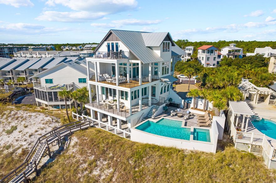 This extraordinary coastal estate, situated on over an acre, boasts 95 feet of Gulf frontage. Renowned Nashville designer Chad James has embodied this residence with an aura of southern opulence and sophistication, while architect Geoff Chick and builder Chris Clark have reimagined this private coastal retreat.Step inside this luxurious estate and experience a seamless fusion of timeless design and unrivaled comfort. The entrance, accessed through a private gate, sets the stage for a truly remarkable experience that also offers endless potential for further development. As you explore the grounds, you'll discover a custom Gulf front pool surrounded by lush thoughtfully designed landscaping, creating a serene oasis.