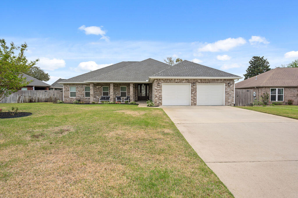 Welcome to this stunning four-bedroom, 3 bath home nestled in the lovely Raintree Estates.  Built in 2016, this gorgeous all brick home radiates sophistication and comfort and is situated on a generous .29 acre lot.  You are welcomed with an inviting entrance and a wonderful split bedroom floor plan with Master on one side and additonal bedrooms on the other. The gourmet kitchen is a chef's delight, featuring sleek cabinetry, modern appliances, built-in wine fridge and tons of counter space, making it perfect for both cooking and entertaining. Cozy back patio leading to a spacious backyard that you will absolutely love! It has plenty of room for just about anything including a pool! This home has been meticulously maintained by one owner over the past nine years and now ready for a new one! 