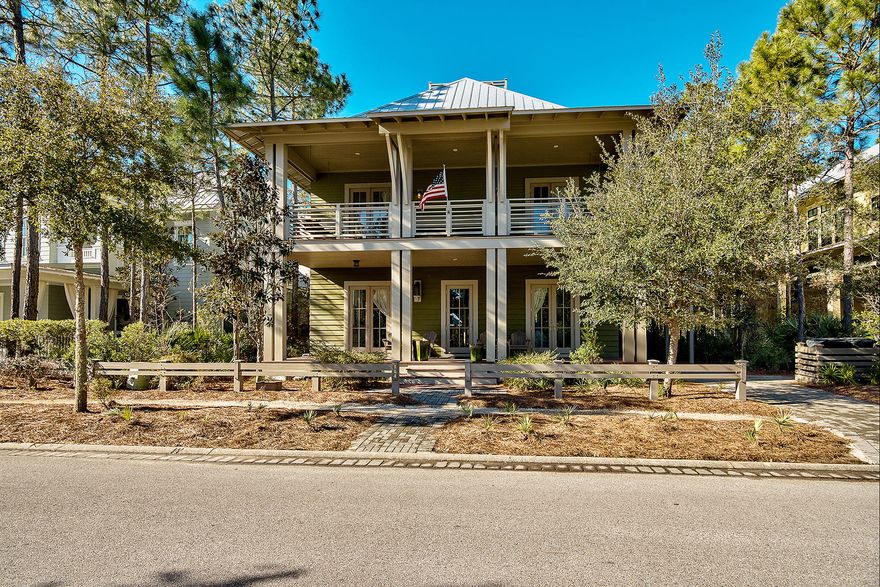Backing up to a serene nature conservation, this WaterColor home is virtually equidistant from the popular Camp WaterColor pool amenity, as well as convenient shopping and dining at WaterColor Crossing, each just over a quarter mile away. Front and back covered porches on both the 1st and 2nd floors span the width of the home, adding significant outdoor living space to the already substantial indoor space. The fenced back yard includes a sprawling brick paved patio, ideal for hosting evening gatherings around a fire pit; there is even room for a pool. Expansive floor-to-ceiling windows are the trademark of this home, inviting tremendous amounts of natural light into two of the four 1st floor guest bedrooms, 1st floor den, stairwell, and 2nd floor dining area.
