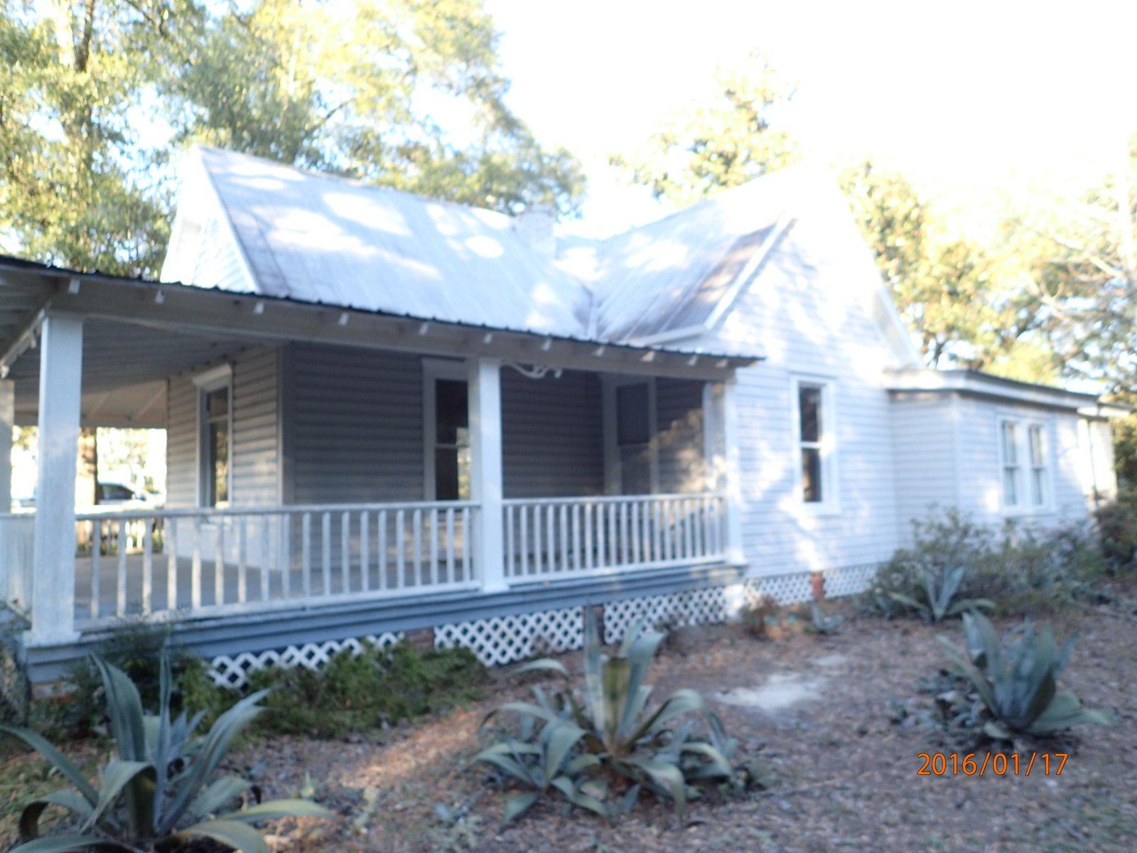 Located in the Historic District of Defuniak Springs, this REO home was built in 1910 and comes with tons of potential! Home has wood siding, large open porch, partial wrought iron and chainlink fence, and metal roof. Inside this corner lot home, you will find a fireplace, wood floors and tongue and groove wood on some of the ceilings. Home has plenty of character and is priced based on current condition. A fantastic home for that person with just a little bit of vision! Call today and scheudle your showing.