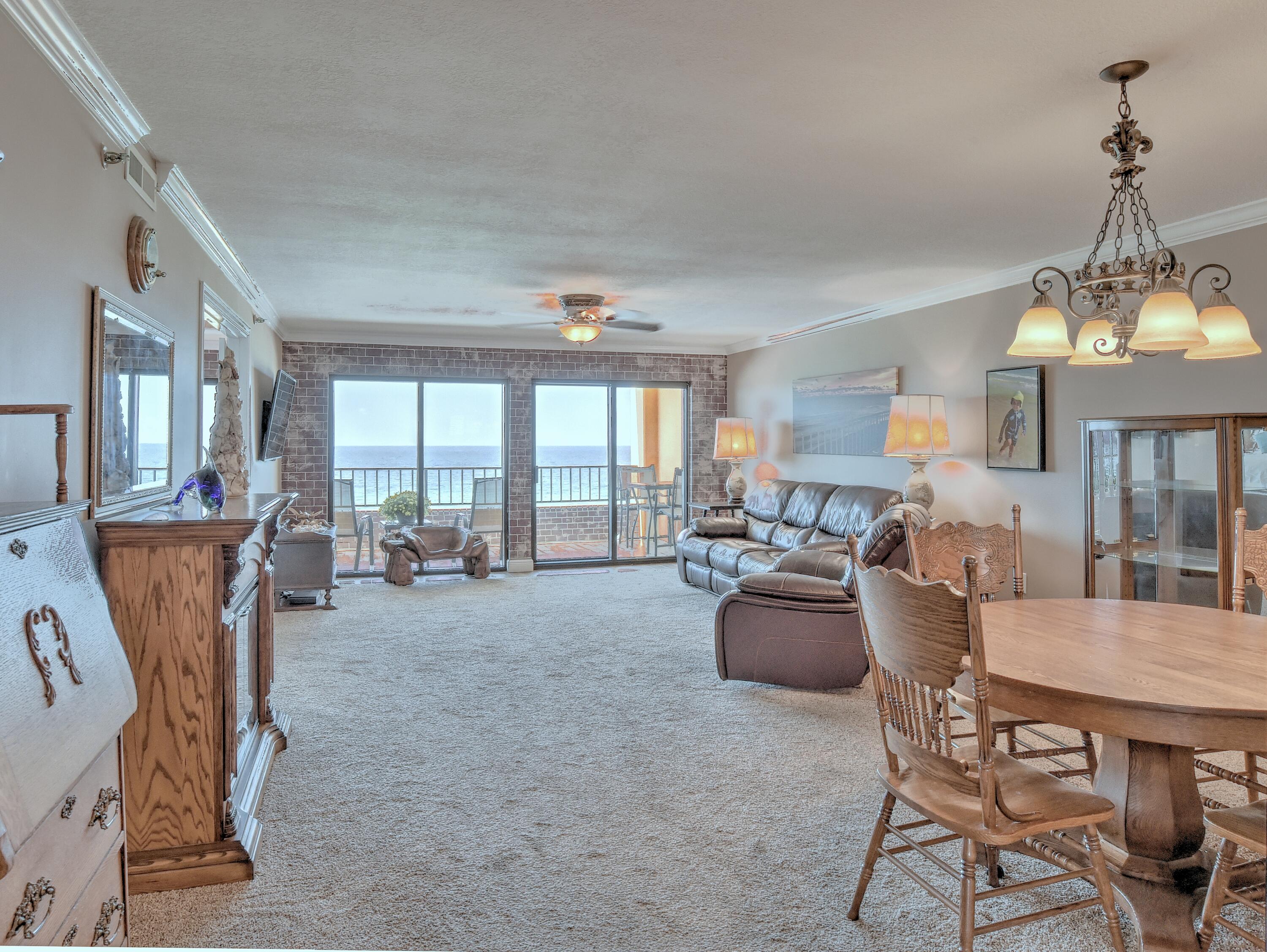 This is truly a rare find. It's not often you find this size unit on the market. This unit features 2 bedrooms, 2 baths with amazing views of the Gulf of Mexico from the 7th floor from both the living area and the master bedroom. It has been recently updated with luxury features found in very few condominium units on Okaloosa Island. Crown molding and custom baseboards have been added throughout. The kitchen includes granite countertops, custom cabinetry, a patterned tile flooring with decorative inlay, and enhanced lighting. Upgrades in 2014 include a full suite of GE Slate kitchen appliances and a full-size stackable LG washer and dryer. A new (2021) Stiebel Eltron tankless hot water heater has been embedded into the wall and the utility closet has been tiled to provide additional