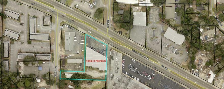 The property is improved with two buildings. The main building which is approx. 12,000 square feet fronts on Racetrack Road and has four units and a second building that is located on Falcon Place that is approx. 1230 square feet.Plenty of paved parking in front of both buildings and additional parking and storage area behind the buildings.