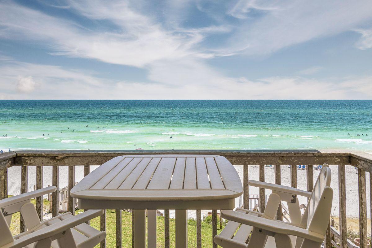 Nestled on the beach in Blue Mountain is this quaint 10-unit condominium with a grass yard directly on the Gulf of Mexico! A third floor updated beach retreat with 2 bedrooms & 2 baths, the low density immediately relaxes you! The Board voted to extend the balconies on the upper floors, and that work will be done in December 2021.  Well-located for a short stroll to Blue Mountain Bakery, Blue Mabel, the local health food store or ice cream shop or a couple of local pubs, you'll love not having to get into your car! There is lots of storage space in the community storage rooms for the 10 owners. HOA fees are only $500/month! Most of the owners have owned here for years.