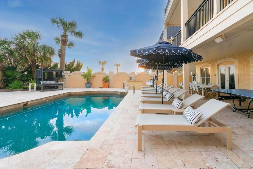 Welcome to Promenade, a stunning Gulf-front retreat in the heart of Miramar Beach where timeless coastal architecture meets elevated design and unforgettable views.Thoughtfully designed to celebrate its beachfront setting, this seven-bedroom, five-bath residence offers seamless indoor-outdoor living with expansive water-facing patios, double balconies, and a crow's nest overlooking the Gulf and the private pool below. Every level is oriented to maximize natural light, sea breezes, and panoramic views of the emerald coastline.The private pool invites both leisure and activity -- ideal for swimming laps or cooling off after a sun-soaked day on the sand. Scallop-trimmed umbrellas, a hammock, and shaded lounging areas create a relaxed resort atmosphere, while the modern outdoor fire pit provides the perfect gathering place just steps from the beach.

Inside, the home makes a striking first impression with marble floors, a grand staircase, and a crystal chandelier anchoring the opulent foyer. Spacious living areas flow effortlessly into outdoor entertaining spaces, offering multiple settings for hosting and relaxation. A standout feature is the custom bunk room complete with double bunks, a foosball table, and a smart TV -- a favorite gathering spot for guests of all ages.

Whether enjoying sunset dinners al fresco, morning coffee overlooking the Gulf, or evenings under the stars with family and friends, 747 Scenic Gulf Drive offers the ultimate Gulf-front lifestyle -- a rare opportunity to own a legacy property directly on the sand in one of the Emerald Coast's most desirable locations.