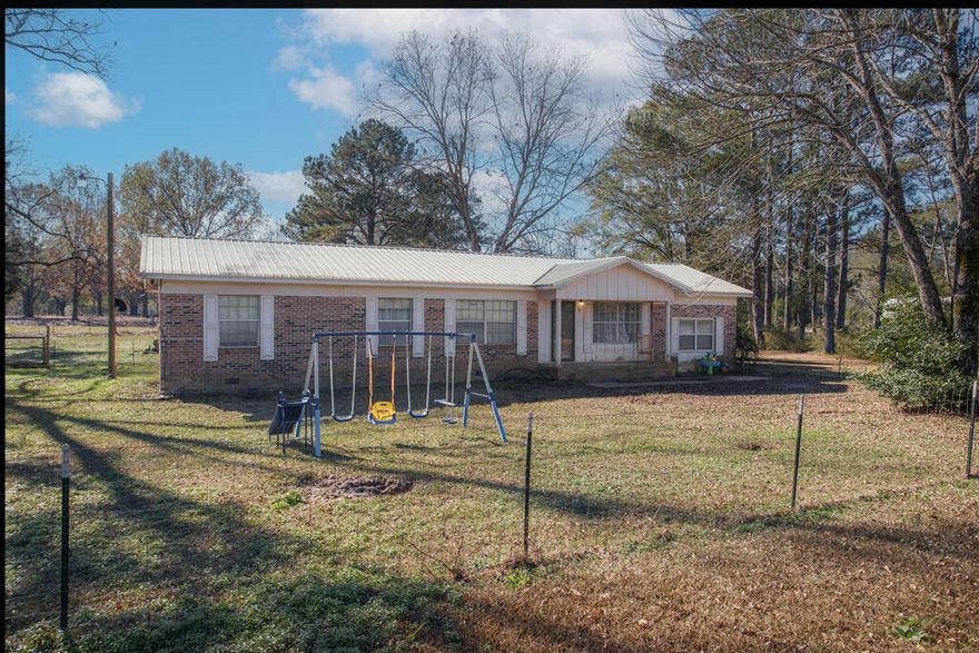 SPACIOUS ALL BRICK RANCH ON 1 ACRE, and this one comes with a METAL ROOF AND UPGRADES!Welcome to 71 Ferrene Dirt Road in Luverne, Alabama (Friendliest City in the South). This well-maintained 4 BR/2 bath floorplan offers 1725 square feet of country living on a fully-fenced lot, with peaceful views in every direction. Built in 1972, the home combines solid construction, with key updates for comfort and efficiency. Updates include:  METAL ROOF, NEWER HVAC, NEW LUXURY VINYL PLANK FLOORING, NEW PAINT, NEW LIGHT FIXTURES AND BRAND NEW REFRIGERATOR. Step inside to formal living with adjoining family room, country kitchen with designated dining, 4 spacious bedrooms, 2 updated bathrooms and crown molding throughout. Affordable rural living, COUNTY-MAINTAINED ROAD,(continued) just outside city limits, with quick access to schools, grocery and stores. 

Better hurry! This one is PRICED TO MOVE!