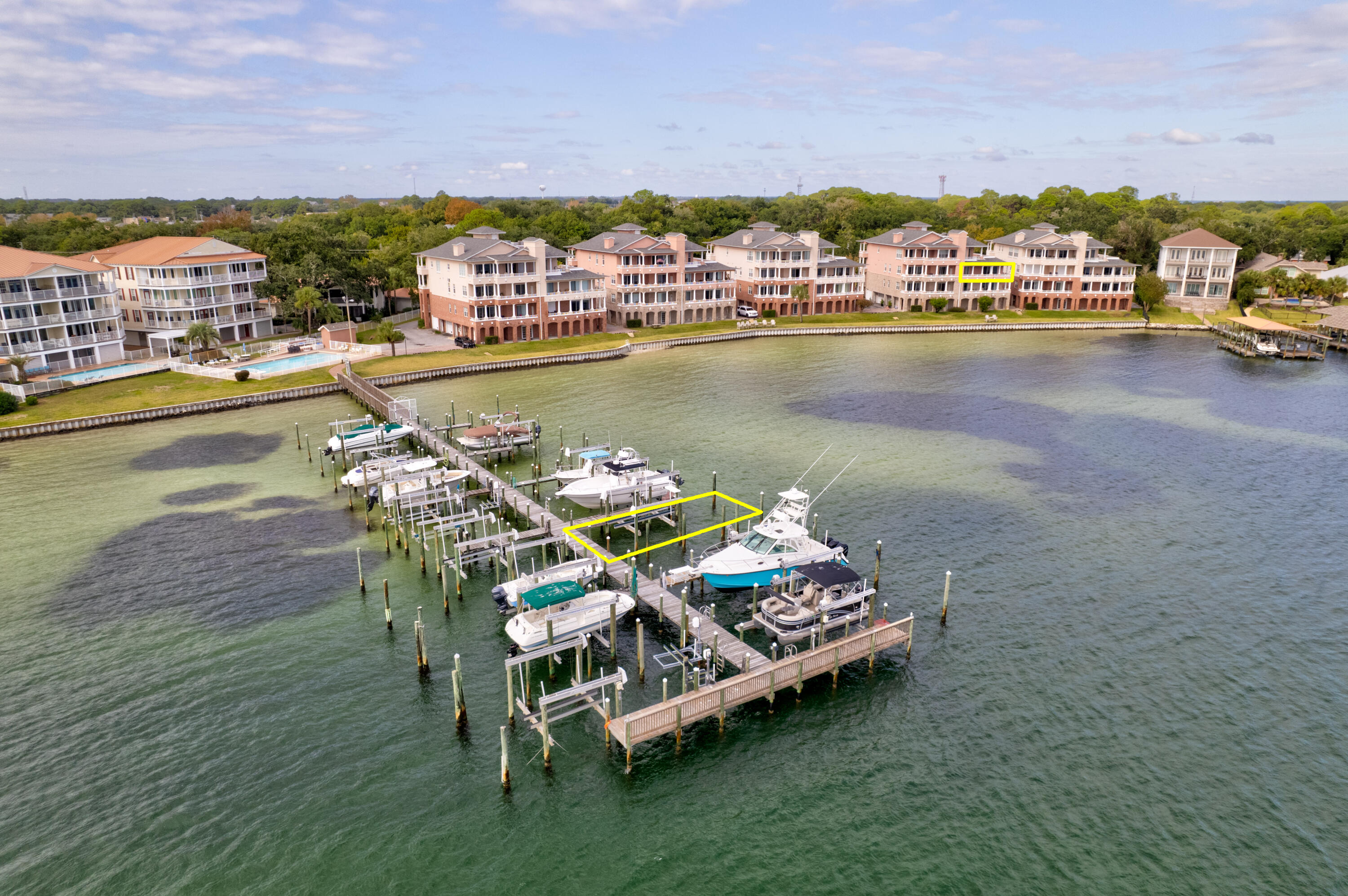 This is a great 2nd floor unit in a 4 story building with boat slip #3 included and excellent views of the Choctawhatchee Bay and the Intercoastal waterway. See the white sandy dunes all the way to the Destin Bridge, watch the fireworks on Wednesday evenings from your balcony between May and September. The gourmet kitchen is only one of the many upgrades. 9 foot ceilings, crown molding, a decorative mosaic Compass tile inlay in the entry, and a balcony off each bedroom. There is a whirlpool garden tub and separate shower in the master suite. There is a private enclosed 2 car private garage & an 11'x11' separate storage unit on the ground floor. The elevator makes for an easy '' lock and leave'' and ''one level'' lifestyle. New hot water heater and Garbage disposal in 2025.