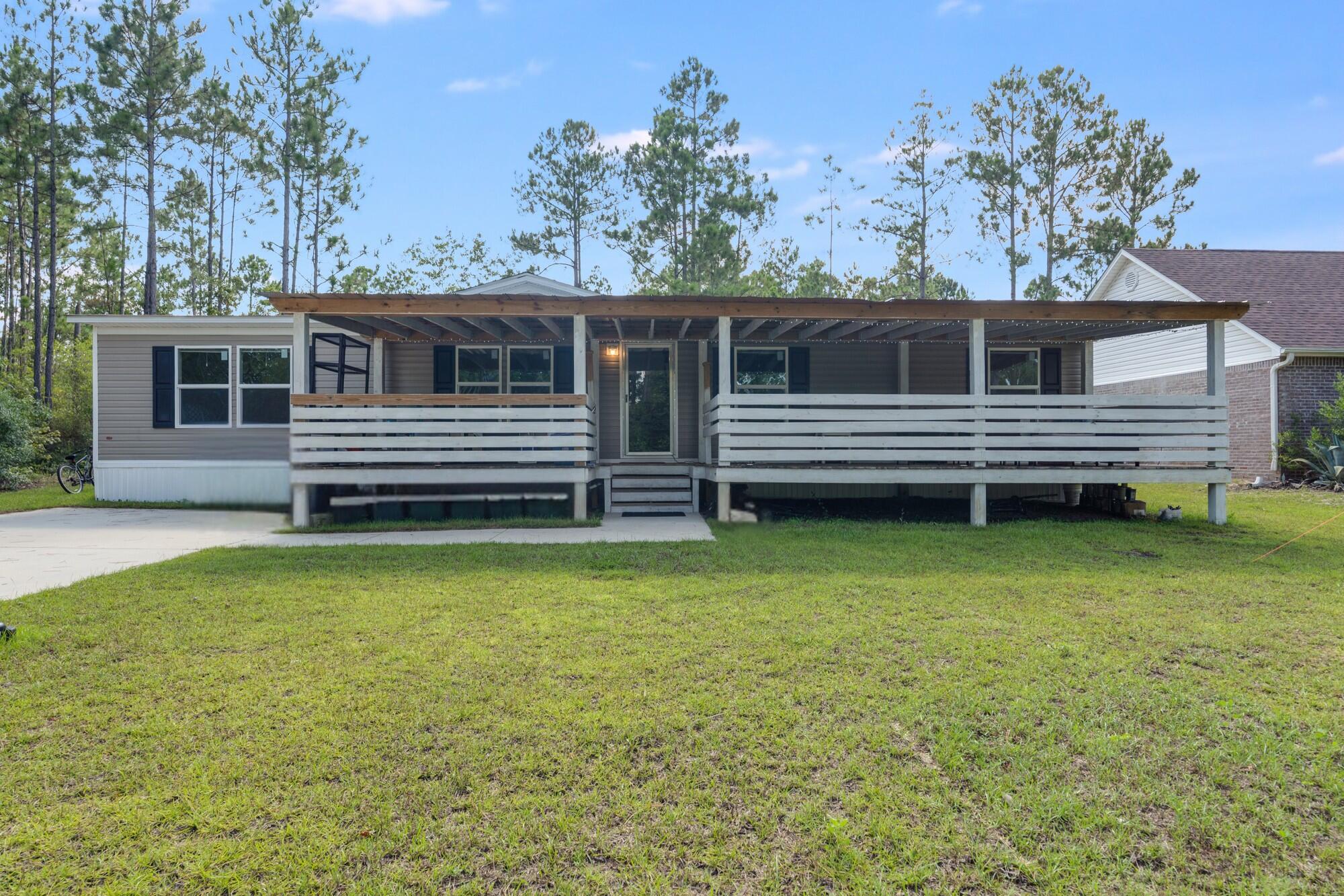 Tucked away in the heart of Santa Rosa Beach, this 4 bedroom, 2 bathroom home offers the perfect mix of comfort, location, and laid-back coastal living. Built in 2022 on a quarter-acre lot, the property backs up to a quiet canal that connects directly to Choctawhatchee Bay -- perfect for kayaking or YOLO boarding straight from your backyard.Inside, the open-concept layout features durable LVP flooring throughout and a spacious, well-kept interior. The large primary suite includes a generous walk-in closet, and all furnishings are negotiable. Out front, the oversized porch is an ideal spot to enjoy your morning coffee or unwind in the evening.Located just minutes from 30A's beautiful beaches, Ed Walline Beach Access, Grand Boulevard, and favorite local restaurants like The Bay, Shunk Gulley, and Stinky's Fish Camp. Publix, parks, boat ramps, and scenic trails are all nearby, offering convenience without sacrificing privacy. This is a rare opportunity to own a well-maintained home in one of Santa Rosa Beach's most accessible and adventure-ready areas.