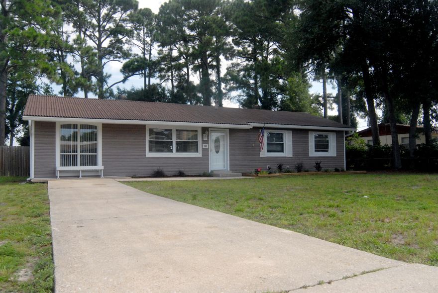 STOP THE CAR! This is the one you've been looking for! Cute, updated, spacious, large yard, and best of all  affordable!! Located in the heart of FWB, this 3 bedroom, 1.5 bath home is ready for your family! It's close to shopping, white sandy beaches, Hurlburt Field and Eglin AFB plus it's turn key & move-in ready! NEW paint throughout, NEW carpet in the bedrooms and bonus room! As you enter the home, you step into a foyer area that opens into the front family room and open dining room. The dining space features additional pantry space and includes the sliding door (with removal pet door) out the backyard. The Kitchen has NEW tile flooring and features stainless steel appliances and sink. All appliances convey with the home.