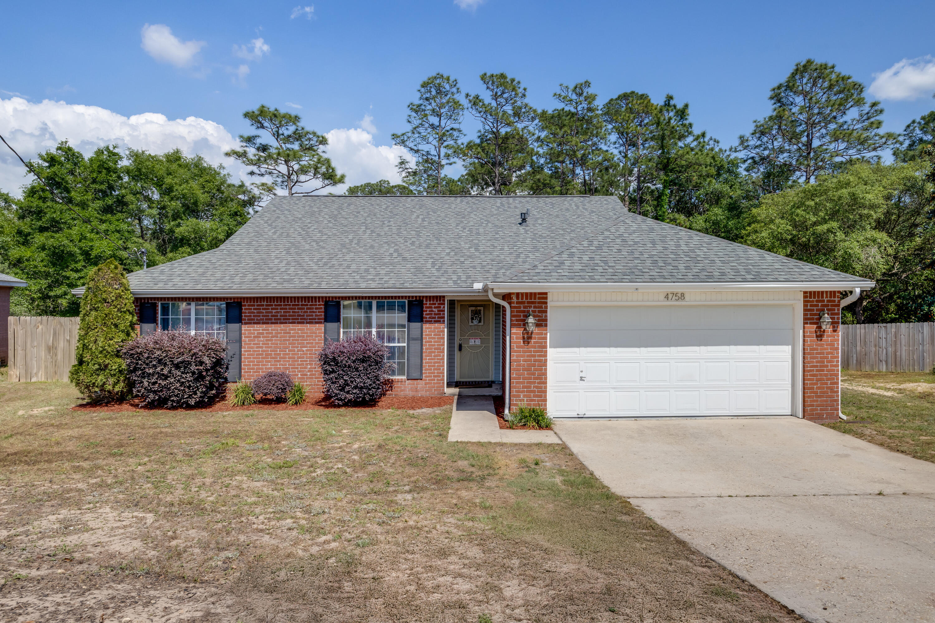 South Crestview! Nearly half an acre with a peaceful view off the back deck and NO HOA! Features include: Kitchen updated with quartz countertops, new stainless steel appliances including a gas stove and microwave. Bathrooms updated with new vanities, quartz countertops, and LED mirrors. This home shines with its vaulted ceilings and wood laminate flooring. Take a step out the back door to the expansive back deck overlooking the serene undeveloped woods. Enjoy the benefits of solar power with a monthly power bill of $25! Roof 2020, HVAC 2020, Water Heater 2025. Schedule your showing today!