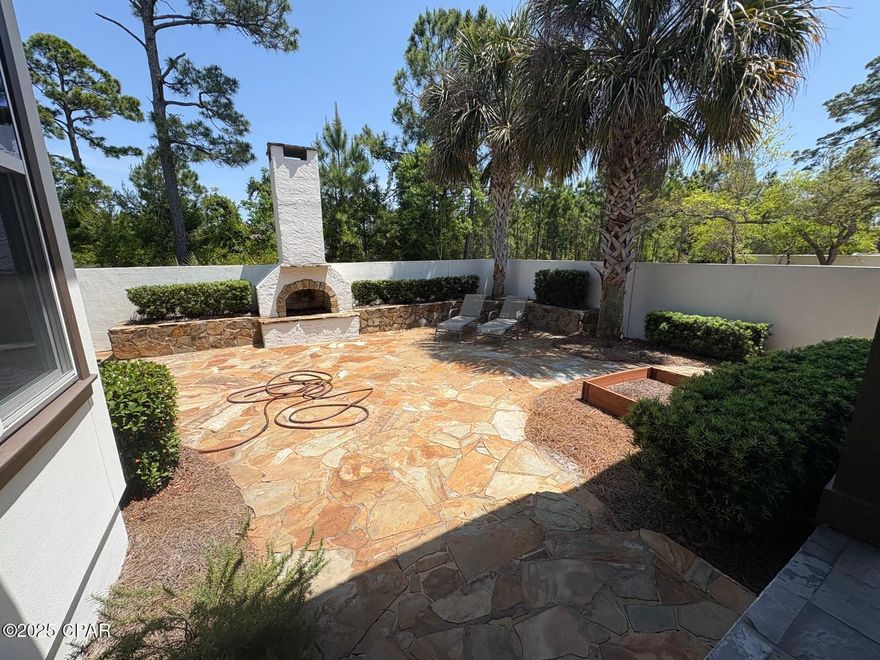 Absolutely gorgeous home, in the much sought after gated beach community of Martinique. This unique and stunning home is one that you must see. From the moment you step inside, you will love the bright and airy feel of this home. The kitchen features top of the line stainless steel appliances and is open to the oversized living room area. The high ceilings have the added detail of custom-made wood beams. The living area flows into a peaceful and spectacular outdoor living area that has a hot tub, outdoor fireplace, and waterfall. This is a wonderful space for entertaining and overlooks a small pond in a serene courtyard oasis with lots of privacy. The downstairs also features a large room that can be used as a large office or formal dining area