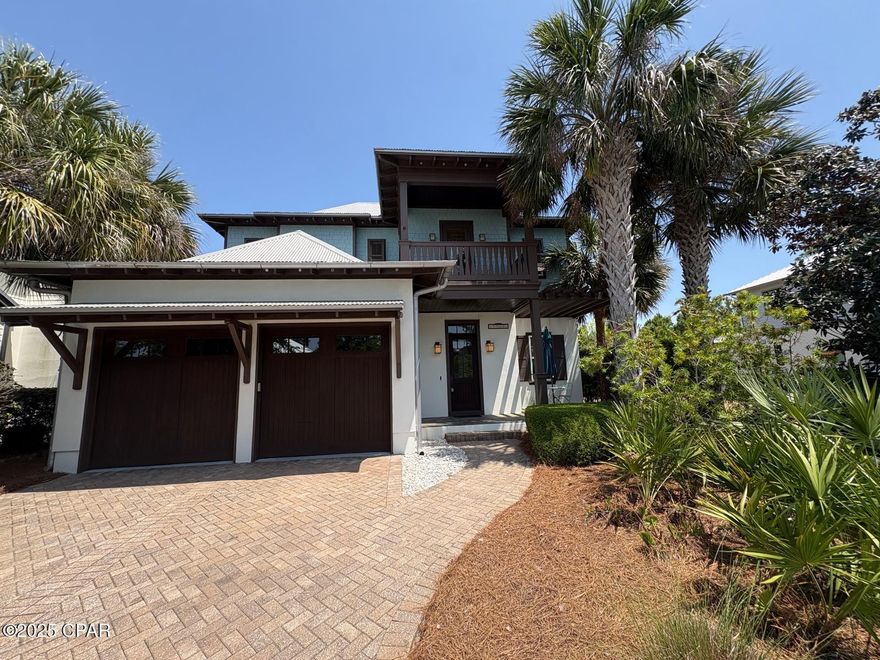 Absolutely gorgeous home, in the much sought after gated beach community of Martinique. This unique and stunning home is one that you must see. From the moment you step inside, you will love the bright and airy feel of this home. The kitchen features top of the line stainless steel appliances and is open to the oversized living room area. The high ceilings have the added detail of custom-made wood beams. The living area flows into a peaceful and spectacular outdoor living area that has a hot tub, outdoor fireplace, and waterfall. This is a wonderful space for entertaining and overlooks a small pond in a serene courtyard oasis with lots of privacy. The downstairs also features a large room that can be used as a large office or formal dining area