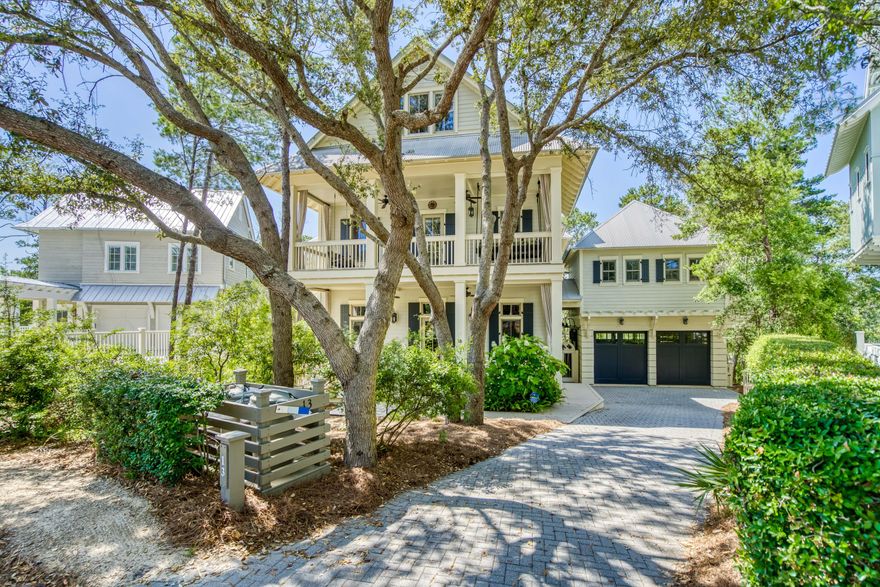 Located in the coveted community of WaterColor, this breathtaking home offers a prime location nestled on Western Lake with calming views of the lake and landscape from all three levels. The elegant entry takes your eye through the home to the lake as you are welcomed to the great room boasting soaring two story ceilings with wooden beams. Step up to enjoy the dining area and Kitchen  complete with a butler pantry and large screen porch all opening up to the lakefront views. The first floor also offers a master suite and additional sitting area. For added accessibility, this home also offers an elevator servicing all floors.  As you ascend to the second floor, the staircase surrounds you with pecky cypress walls  and ceiling. The specially designed iron staircase provide an added artistic element. The second floor hosts three bedrooms/study each with a ensuite. All three  bedrooms provide access to the screen porches. The master suite and study open up to the lake while the wide hallway wet bar is convenient for each of the rooms.

This home has no shortage of extra features. The timeless and interesting design features have been  well thought through with the utmost attention to detail, including the top floor large entertainment room complete with a pool table, TV area and sweeping lake views. The spacious and creative bunk room does not disappoint in design.

Moving to the outdoor living area on the way to the carriage house, enjoy a private soaking pool overlooking the lake perfect for enjoying throughout the year. The garage offers the ability to open up to the pool area...Great for a party! 

This is the perfect home hosting guests or enjoying time alone.
