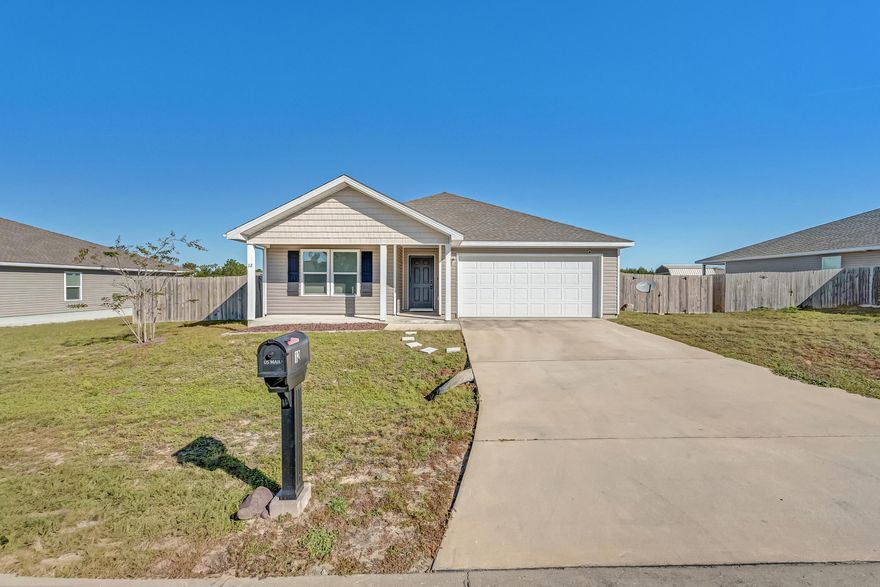 Tucked away on the outskirts of DeFuniak Springs, this inviting 4-bedroom, 2-bath home offers comfort, space, and a peaceful setting while keeping you close to town. The large open living area provides plenty of room for gathering, dining, and relaxing -- an ideal space for everyday living or entertaining guests. The functional floor plan features a spacious primary suite with a private bath, plus three additional bedrooms that can easily serve as guest rooms, a home office, or flex space. The split-bedroom layout adds a touch of privacy, while the open design keeps everything feeling bright and connected. Step outside to the fully fenced backyard perfect for enjoying quiet evenings outdoors or sipping your morning coffee on the patio.