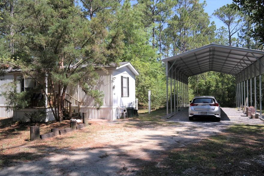 This affordable mobile home located on 1/2 acre and only minutes to the bay, would make a great weekend getaway or rental property. There are 2 bedrooms, 2 full baths, open floor plan and a kitchen island. Although it could use a little clean-up on the lot and exterior, the home is in great condition and move-in ready. New dimensional shingle roof installed apx. 2 years ago. Home is on public water and sewer. Schedule your appointment today!