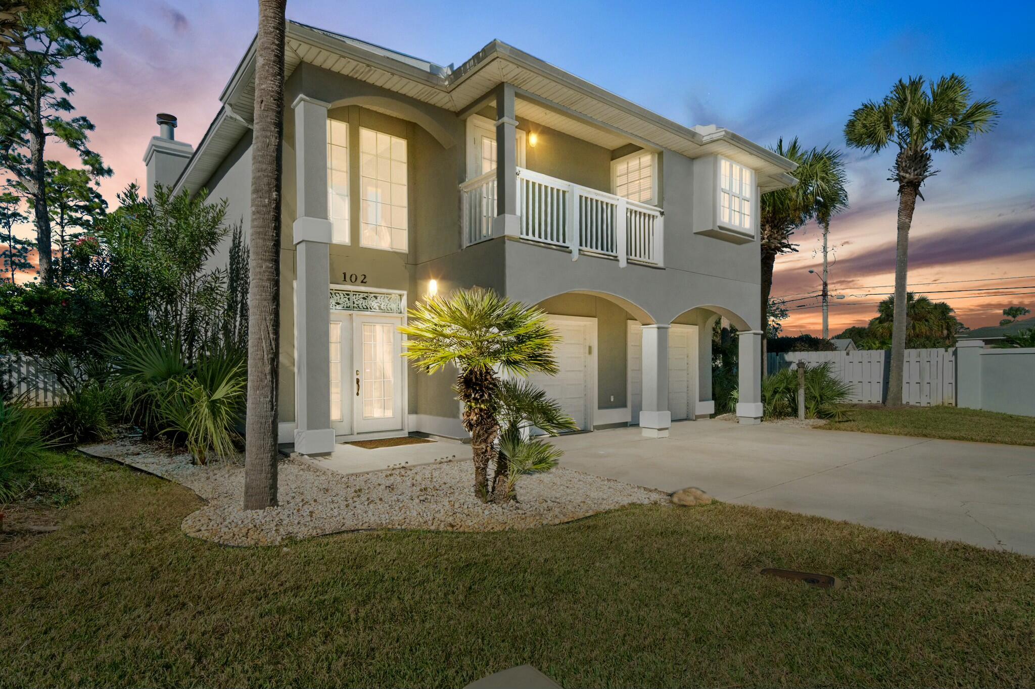 Looking for a highly sought after, upscale, gated, waterfront community complete with Lagoon front pool, marina and your very own dedicated boat slip with 10,000 lb lift? Lagoon Estates on North Lagoon Drive in Panama City Beach is THE ONE! This one has it all! Lagoon Estates is located on the East End of Panama City Beach close to all the local's favorite restaurants, St Andrews State Park, three marinas and just a short boat ride into St Andrews Bay, Shell Island and the Gulf of Mexico for all the saltwater activities you love! Per the updated FEMA Maps, this home is located in Flood Zone X. All of Florida is in a designated flood zone. X is the best one to be in with the least chance of flooding making flood insurance on this property more affordable than any other flood zone. This quiet neighborhood enjoys a gated entrance on a cul de sac, privately owned street. The waterfront community room and pool look out onto the marina, Lower Grand Lagoon and all the privately owned boat slips fully equipped with lighting, electricity and water. Primary and second home ownership and long-term rental investments ONLY. No short-term rentals here. This home is something to see! As you enter the foyer through the integrated blind double doors you immediately look up to the 18' ceilings, crown molding, gorgeous wooden staircase with tile accents and all the natural lighting coming in from the many windows. You pass the updated half bath and enter the spacious living room showcasing 18' ceilings with even more windows, plantation shutters and natural lighting. The gas fireplace is the center piece of the room with hutches on either side to display all your loved ones and memories here on the water. Windows all along the back of the home bring the natural light in and take you outside to the spacious, enclosed Florida room and then out to the expansive, open air, private, paver patio. No neighbors to the right providing an extended backyard with lawn maintained by the HOA and lush greenery to the left to create a relaxing oasis. Moving from the open concept living room to the spacious dining room allows you to view this gorgeous space as well. The kitchen is fully equipped with Frigidaire Gallery appliances and a newer Bosch dishwasher. Plenty of counter space as well for the gourmet chef including a kitchen island with cabinets! Upstairs you will find hardwood flooring in the halls and bedrooms and neutral, tasteful tile in the bathrooms. The magnificent master bedroom with ensuite also connects to the front balcony. The ensuite is equipped with a large walk-in closet with closet organizer, garden tub, separate shower, double vanity and water closet. The guest bathroom is just down the hall and showcases a single vanity and shower/tub combo. One of the guest bedrooms was originally set up as an office and the other guest bedroom is considerably larger with a closet organizer and connects to the guest bathroom and spacious balcony overlooking lush greenery. Other important items to consider are the two HVAC units were replaced just two short years ago, the exterior painted 5 years ago, tankless water heater, water softening system, insulated garage doors with Chamberlain Wifi garage door opener, integrated blinds in all exterior doors and an LG washer/dryer. This home is competitively priced so don't wait. Call to schedule a private showing of this home and neighborhood and see why this is where you belong! Verify measurements if important.