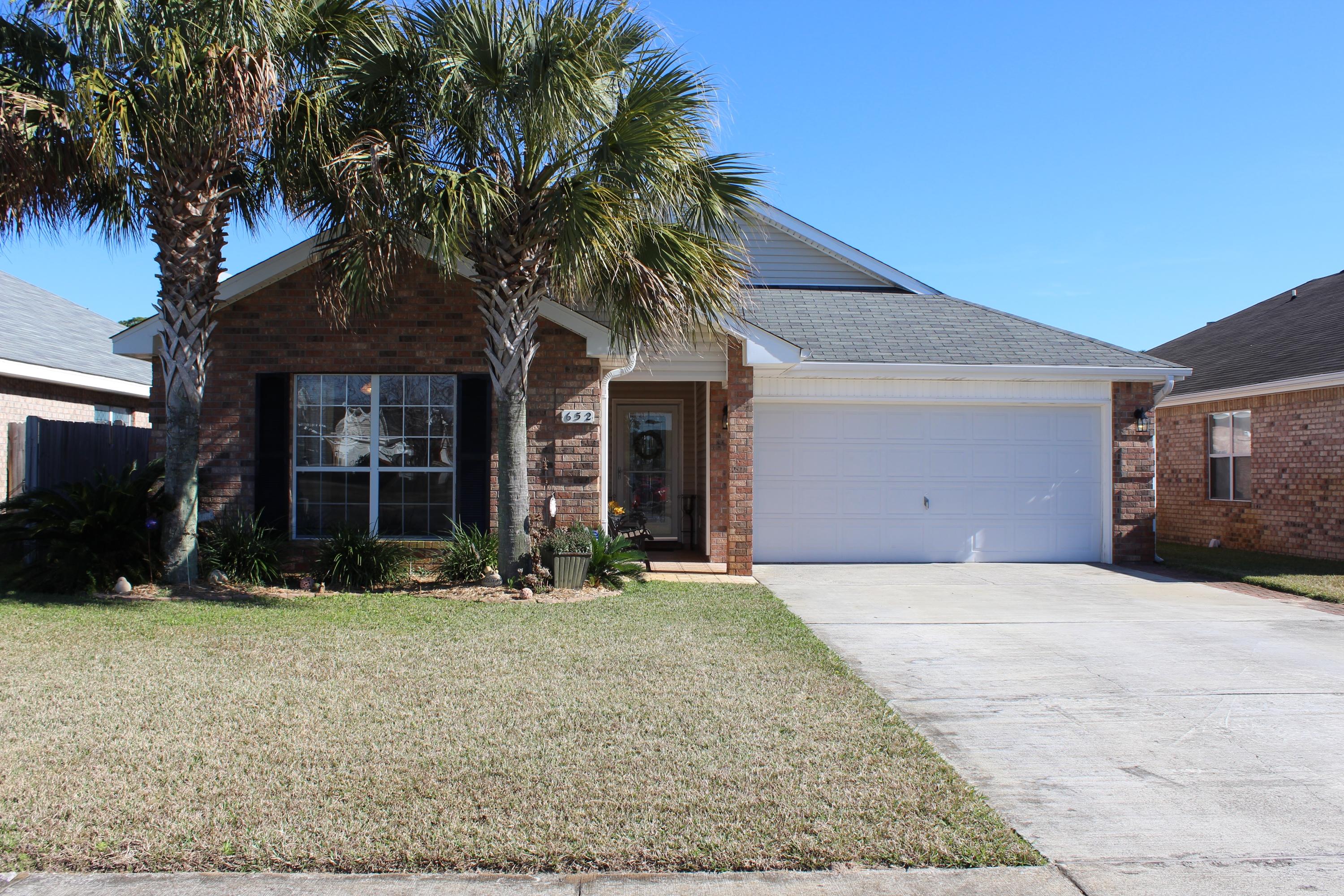 Beautiful 4 bedroom/2 bath home in the sought after Emerald Village neighborhood. Across from the back gate to Hurlburt Field. Great open floorplan with the dining room, oversized kitchen and eat in nook all open to the living room. Hop-up bar and island in the kitchen makes this a great home for entertaining. Very well laid out home with a split floorplan. The master bedroom opens to the back porch and has a great master bathroom with a large walk in closet, garden tub, and his and her sinks. Situated at the very back of the neighborhood so the street is extremely quiet. Perfect sized yard-- Not too big and not too small. Shows like a model home! Don't wait--this wont last long!