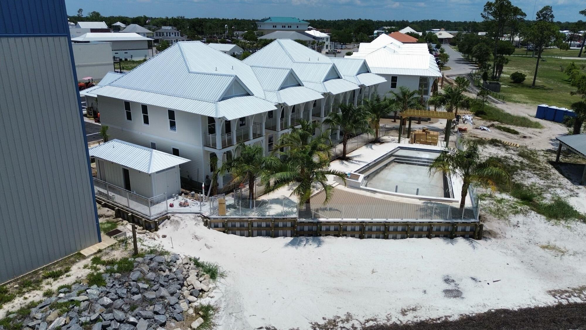 Nestled adjacent to Point South Marina, Marina Cove, St. Joseph Bay, and George Core Park, these thoughtfully designed homes offer not only stunning custom finishes but also unparalleled access to the best attractions Port Saint Joe has to offer. From recreational activities and serene relaxation spots to premier retail, dining, and nightlife, Dockside Village places you right at the center of it all. Whether you're seeking a tranquil retreat or a lively urban experience, Dockside Village is poised to deliver a living experience that truly captures the essence of Port Saint Joe. We invite you to join us in exploring this exciting new community and discovering your perfect waterfront home. (ESTIMATED COMPLETION JULY/AUG 2025)