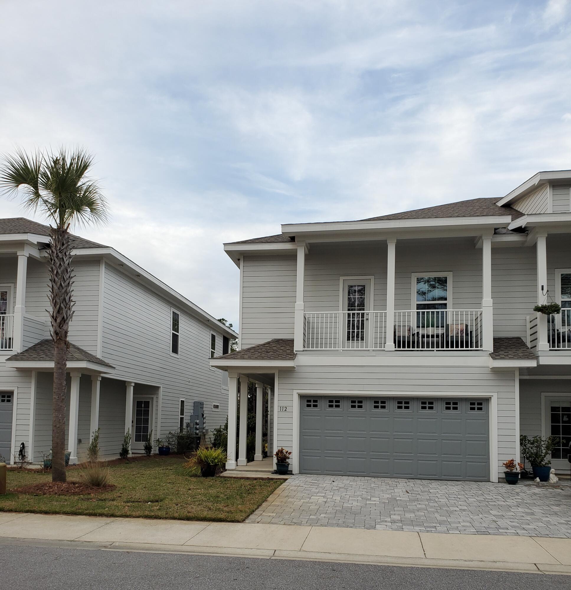 This 4-bedroom, 3-bathroom lakefront townhome in the Kara Lake community offers approx. 2,000 sq ft of living space with modern finishes and convenient features. The open floor plan includes a kitchen with quartz countertops, gas cooktop, and stainless steel appliances. The primary suite with private bath is located upstairs, while a large downstairs bedroom provides flexibility for an office, guest room, or second suite. Storage includes three walk-in closets and custom closet systems throughout. Outdoor living spaces include two screened porches with lake views and an additional patio. A washer/dryer, complimentary internet, and a 2-car garage with storage room are included. Small dogs are permitted. Kara Lake provides a peaceful neighborhood with lake access, outdoor spaces, and a community pool. Located on a quiet cul-de-sac, close to schools, shopping, dining, healthcare, and beach