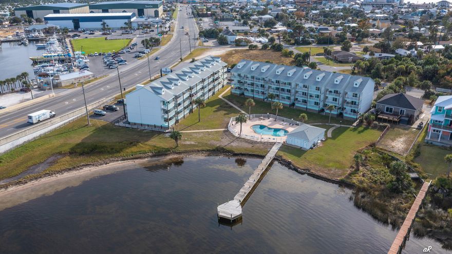 Attention Investors or anyone looking for a primary or secondary home on Panama City Beach! This beautifully furnished, short term rental is turn-key and ready for a new owner. This unit is located in Treasure Cove Condominiums, a lower density complex that overlooks the beautiful Grand Lagoon. You'll be in very close proximity to St. Andrews State Park, Shell Island, & several public beach accesses. You will also find marinas, great local restaurants, boat/jet ski rentals, fishing charters and other tourist attractions within walking distance. The unit itself features newer furnishings and recent renovations which include ceiling fans, light fixtures, white shaker style cabinets, quartz countertop, tile backsplash, stainless steel appliances, subway tile, and vinyl plank flooring.
