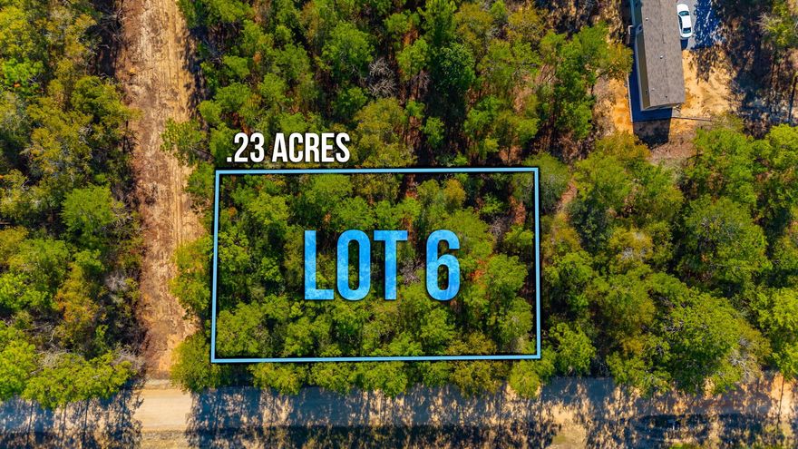 Unleash your dream home's potential on this .23-acre lot in Oakwood Hills Unit 3. No restrictions mean limitless possibilities against a wooded backdrop. Level, flood and wetland-free, this canvas invites manufactured homes. Despite lacking utilities, power and water are at the street. A tap fee awaits and a septic tank is needed. Accessible less than 500 ft from a paved road on a county-maintained road. Just 2 blocks off of Hwy 90, this unrestricted haven offers serenity with the promise of convenience. Seize this chance to define your sanctuary. Adjacent lot is also available for purchase.