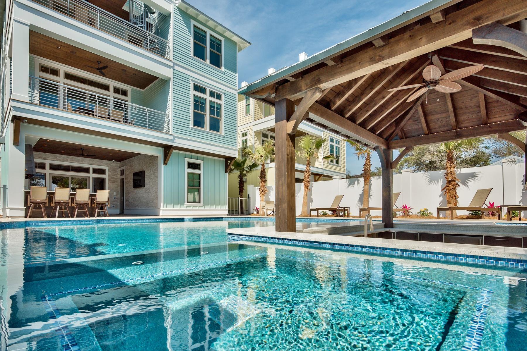 Sleek coastal contemporary design perfectly situated to capture gulf views & masterfully configured providing unparalleled amenities including a Watermark-built 60,000 gallon private resort style pool area complete with a sunken swim-up bar as well as an adjoining spa, in-pool concrete picnic table & covered outdoor summer kitchen. This is the ultimate beach house, an investment magnet with over 25 weeks already on the books for 2017 and $337K in gross projected annual rental income as well as a $300,000 rental guarantee offered 2018+. This home was designed to maximize functionality and finely appointed with chic contemporary finishes while affording optimal comfort & living space. Notable features include multiple indoor and outdoor living areas, private commercial grade elevator, dual