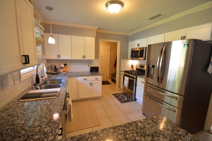 Updated Elliott Point 3/2 Brick Home on a 1/4 acre lot in a great Fort Walton location moments away from Ferry Park, Elliott Point Elementary, and downtown Fort Walton Beach. The kitchen boasts granite, stainless steel appliances and newer white cabinets. Roof replaced in the past 5 years with dimensional shingles. Ample amount of closet space in all bedrooms with new shelving. Walk out into your screened in back patio and enjoy a large back yard with a new privacy fence. Call today to schedule your showing.