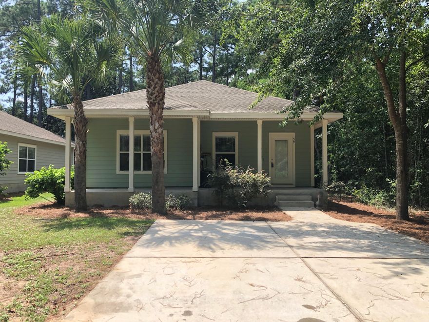 Beautiful Florida Cottage. Stone countertops in the kitchen, maple cabinets with crown, stainless steel appliances, cultured marble bathtubs & vanity tops, double vanity in master bath, walk in closet in master, 9 foot ceilings throughout, 20x20 tile everywhere except the bedrooms, porches on the front & rear of house and many other great features.