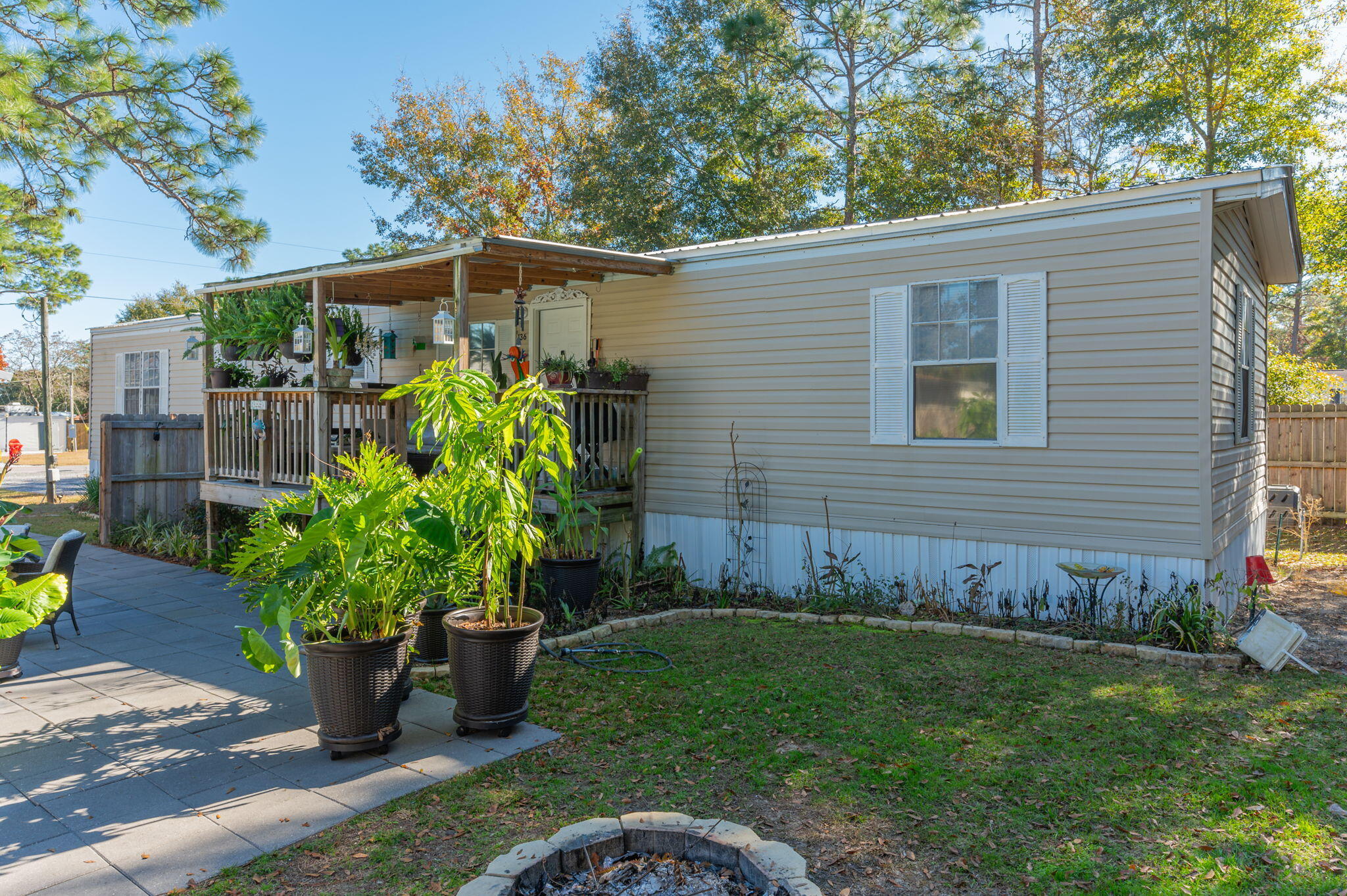 Welcome to this charming 2-bedroom, 2-bathroom manufactured home, offering a perfect blend of comfort and convenience. This home features several updates, ensuring modern living in a peaceful setting. The spacious bedrooms provide plenty of room to unwind, while the inviting living area includes a gel fuel fireplace, adding warmth and relaxation with minimal effort. Both bathrooms have tub/shower combos.Step outside to discover your very own private oasis! The large patio area is perfect for outdoor entertainment and relaxation, featuring an above-ground pool & a fire pit. The yard is partially privacy fenced, offering seclusion and tranquility. Additional outdoor features include a back 9x9 patio, ideal for enjoying the outdoors, and a 20x20 covered carport to protect your vehicles.
That's not all! This property comes with an air-conditioned 10x20 shed, complete with power, a refrigerator, and plenty of storage space. You'll also find a greenhouse for your gardening projects.
The home is being with all existing appliances, including the washer & dryer, as well as some patio furniture, a generator, and a portable air conditioner. Don't miss the opportunity to own this well-maintained home with exceptional outdoor living featuresschedule a tour today!