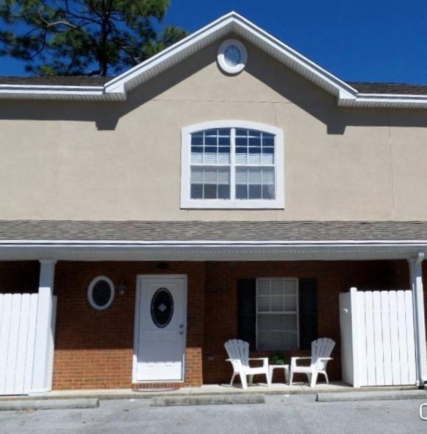 Peaceful setting... This townhouse has an open floor plan. Large living room and kitchen with granite counters and stainless appliances. New A/C within the last year. New paint and carpet. Huge master bedroom. Nice back porch, with an extended deck. Storage room off the back. Super cute! Very Spacious! Move in ready...