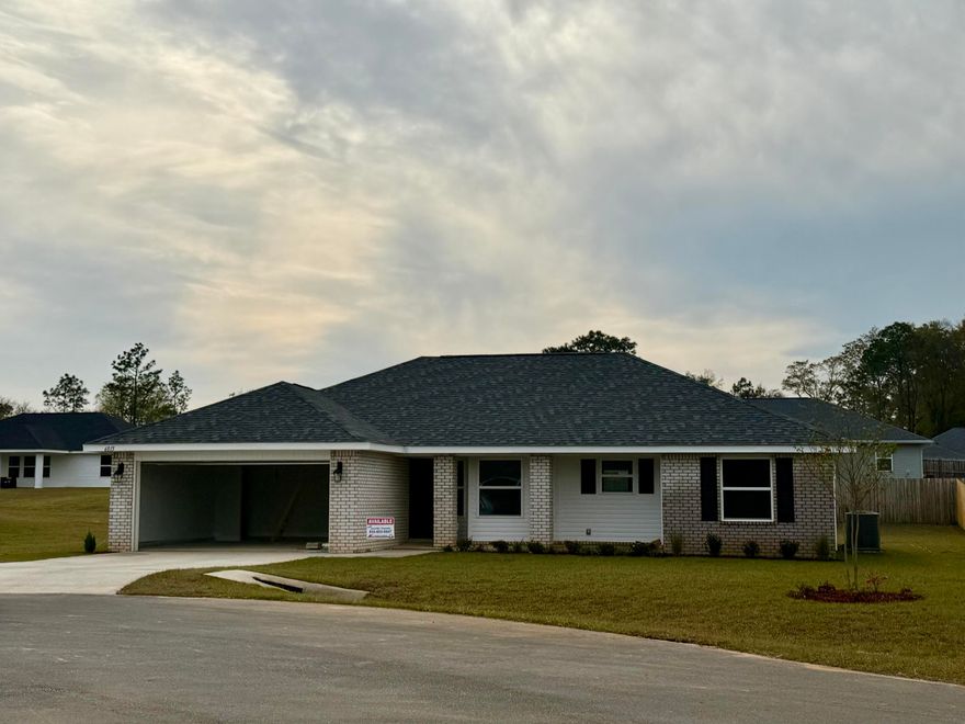 This 1605 sq ft home will feel much bigger as you enter. Both dining and living rooms have cathedral ceilings. The kitchen overlooks the living room and has a lot of counter space! You'll see a lot of natural light coming in as the living room has 3 windows as well as a door out to the large, covered porch, a window in the kitchen and a bay window in the dining area. This is a split bedroom plan. The master bath has both a garden tub with window and a separate walk-in shower. All wet area floors are adorned with an upgraded flooring called Puretec. All other rooms have carpet.