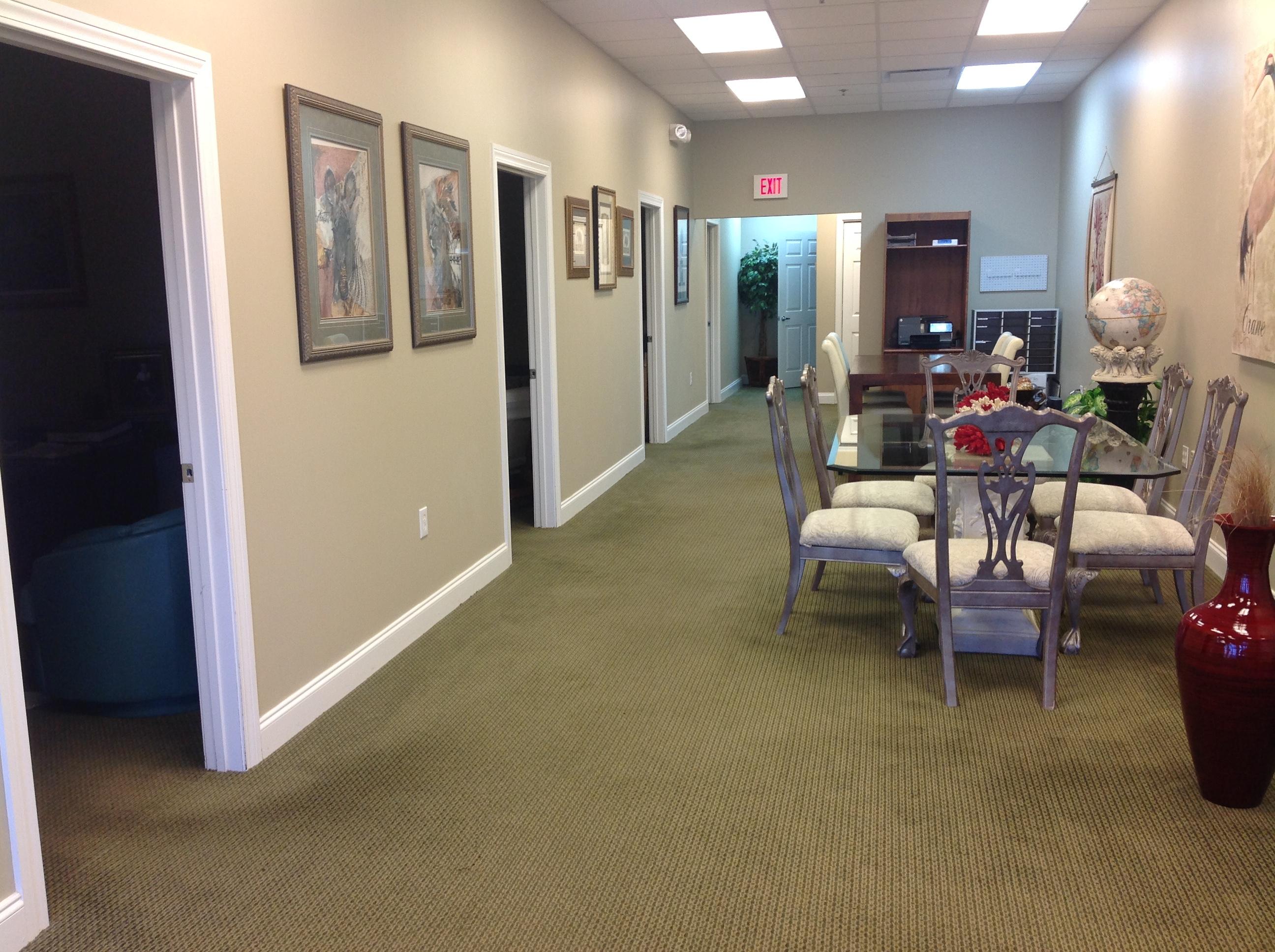 Fully built out unit - perfect for anyone who needs offices AND open space! The unit has four offices down one side with a reception area. On the other side of the unit is a large open area with a bathroom in the back. Speaker system wired into offices. Speakers not included. Furnishings are not included. The Plaza is perfect for that company looking for a high traffic, highly visible site for their business. The Plaza has become a prime retail building with new businesses moving in since the beginning of 2012. Some of the existing businesses in The Plaza include real estate offices, property management, insurance, doctor's offices, a furniture store, a crepe restaurant and a salon. The first two floors of the building are retail/office while the third floor is residential.