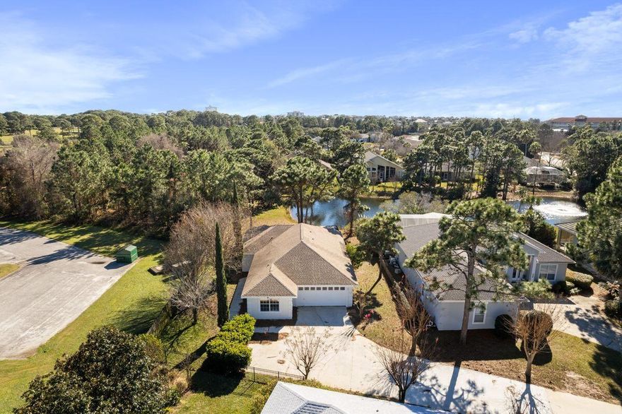 Centrally located near the beach and numerous amenities in Destin and Miramar Beach, this lakefront home in Emerald Lakes boasts an open floor plan, a large private yard and a community pool. Featuring three bedrooms and two-and-a-half baths located in a single-story floor plan, this 1,827-sq.-ft. home has fresh paint inside and out, new flooring throughout, new appliances, vaulted ceilings and a two-car garage. The living area features easy-care tile flooring and a fireplace, adjacent to the kitchen with Corian countertops, a breakfast bar and ample storage. A screened porch in the back of the home overlooks the lake and offers a place of respite from busy workdays or salty beach days.