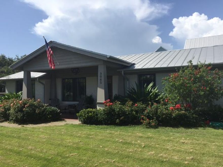 Completely renovated in 2012. Main house w/3 beds 3.5 baths. Viking appliances, restoration hardware lighting fixtures, walnut floors & 12ft ceilings throughout. Custom handmade marble backslashes with matching marble countertops in kitchen and baths. Master features tray ceiling with accent lighting, large walk-in closet, jacuzzi tub, walk-in shower with 3 shower heads and french doors opening to pool & patio. Carriage house with gulf views lives large with full kitchen, family room, bedroom and full bath at 550 sq feet. Below is 550 sq ft climate controlled 2 car garage. Salt water pool with specially designed sun shelf and umbrella. Extensive landscaping, irrigation provided by private well & privacy fence around entire property. Third tier from the gulf, beach access 400 yards south.