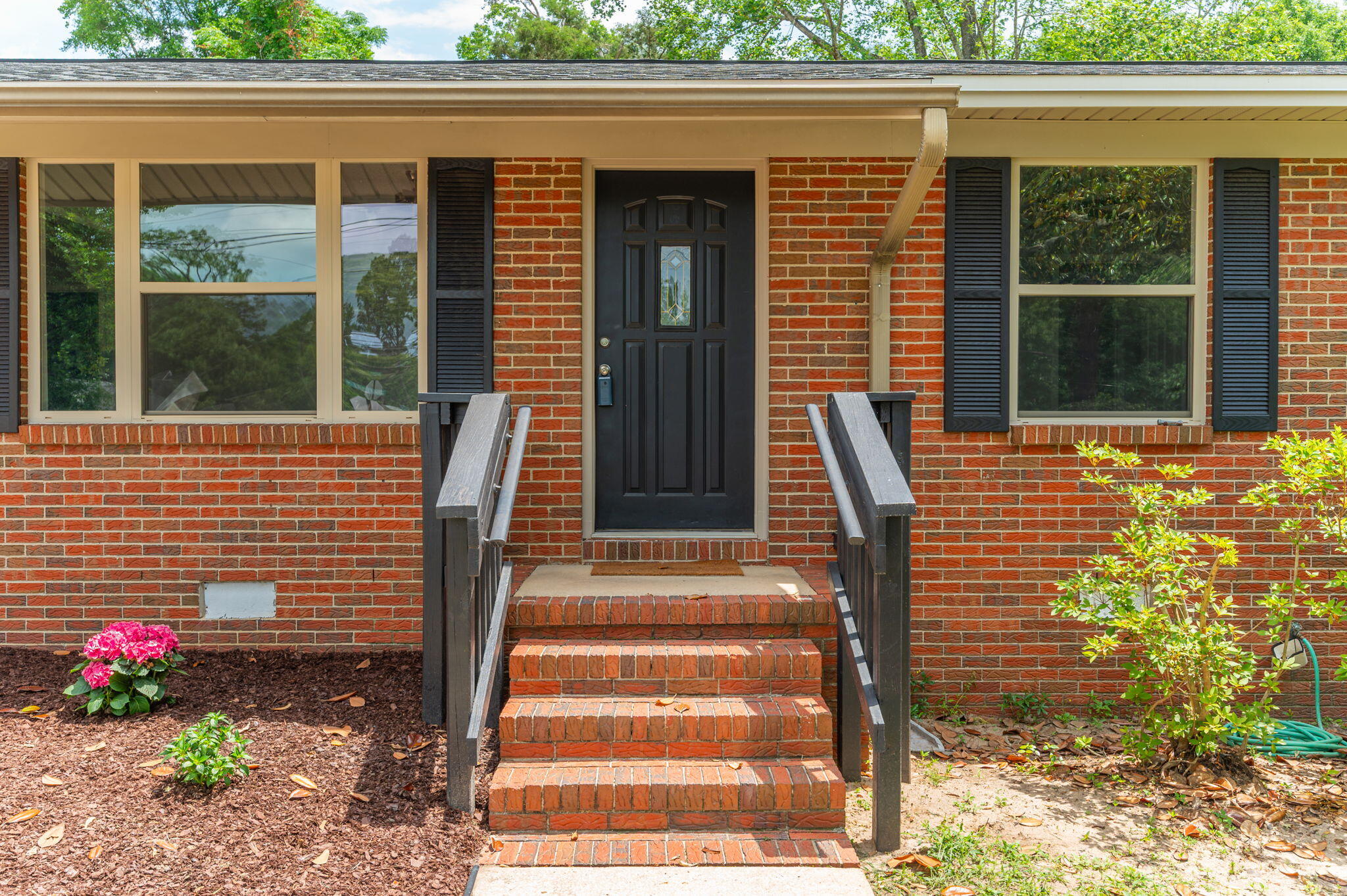 *** SELLER PAYS $5K TOWARD BUYER'S CLOSING COSTS!! *** Beautifully renovated 4 BD/2 BA home situated on a large nearly 1/2 acre lot, this ranch style home features a neutral color palette and Luxury Vinyl Plank flooring throughout. The home has both a living room and family room/den with wood-burning fireplace and brick surround. Eat-in kitchen boasts bright white cabinetry, quartz countertops and stainless steel appliances. NEW ROOF AND WATER HEATER!! The screened-in back porch overlooks the fenced-in backyard complete w/ large workshop and separate yard building. You don't want to miss this one!!!