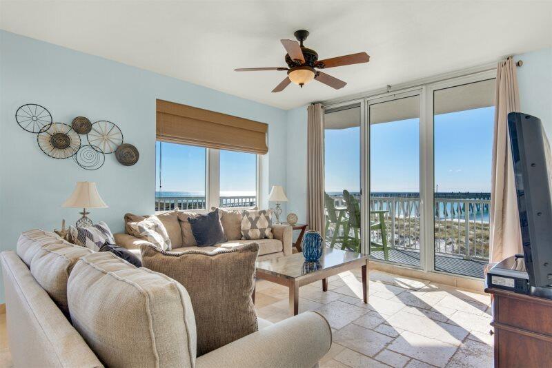 Price Improvement! This stunning beach condo is perfect for your next investment property or personal beach getaway! Offering panoramic views of the Navarre Pier, this fully furnished 3 bedroom 3 full bath condo overlooks the gorgeous emerald waters of the gulf coast. Watch the dolphins play from your wrap around balcony and enjoy al fresco dining at both sunset and sunrise! Gorgeous terrazzo tile flooring flows through the entirety of this unit evoking a summer Tuscan vibe that lasts year around. Located at the top of Navarre Beach, this turn-key condo is close to local restaurants, coffee shops, jet ski rentals, and more!Condo is on a vacation rental program. Unit includes an owner's closet and washer/dryer. Condo roof replaced in 2021