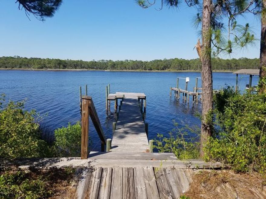 Hurry grab one of the highest elevated lots on Lake Powell. This 87x180 lot is wooded and has an existing seawall and dock. Located within close proximity of the Gulf and just minutes from Rosemary Beach and 30a.